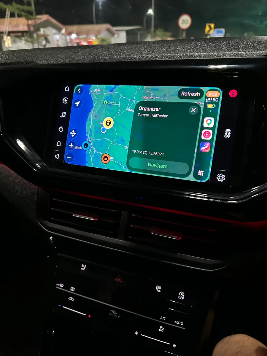 TorqueTrail convoy map running on a car's CarPlay display at night